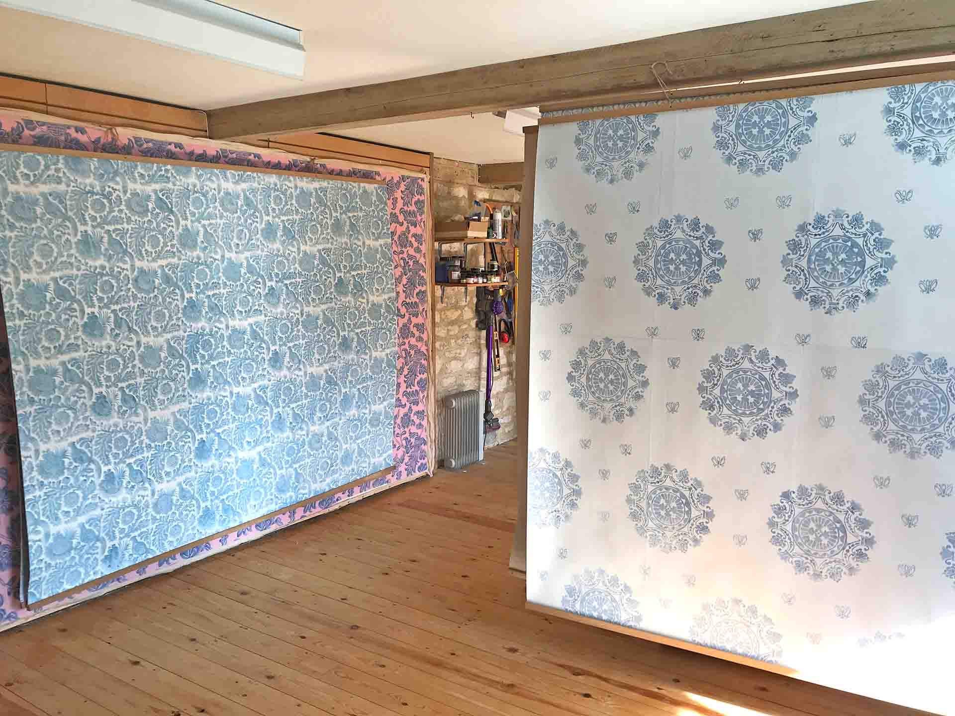 Sheets of Hand Blocked Wallpaper Hanging In The Studio